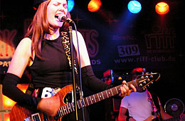 Pamela Falcon and her guitar